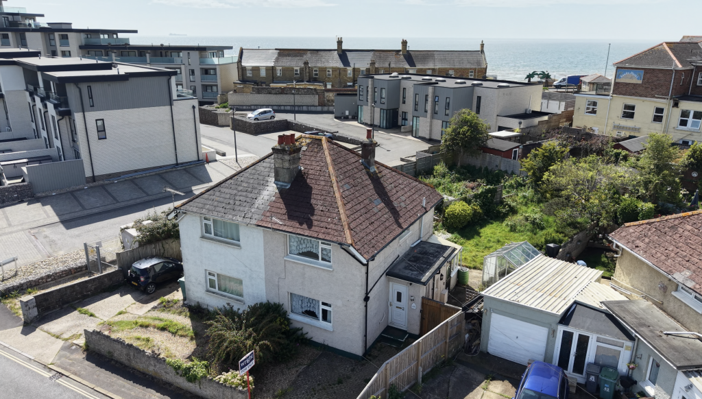 Lot: 130 - TWO-BEDROOM HOUSE FOR IMPROVEMENT - View with sea
